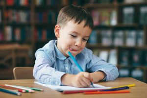 Preschool boy drawing